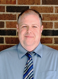 Photo of U.S. Department of Energy Solar Decathlon Design Challenge juror Tom Tishler, the Director of Construction for Kalamazoo Valley Habitat for Humanity in Kalamazoo, Michigan.