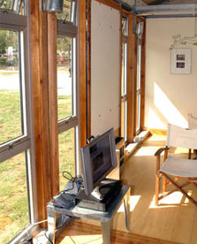 Photo of windows from inside the living room of the University of Texas house.