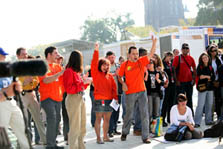 Members of Team Montréal, dressed in orange t-shirts, jump for joy when their third-place finish in the lighting contest is announced.