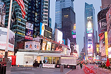 Photo of Lumenhaus at dawn surrounded by skyscrapers in New York City's Times Square.